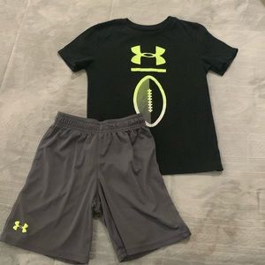 Black, grey, and neon green Under Armour boys shirt and shorts matching set.